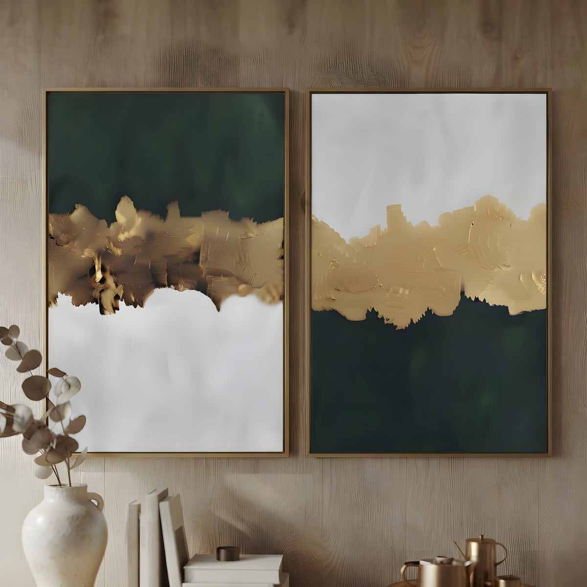 Two framed abstract wall art prints hang on a wood-paneled wall. Each print has a dark green upper section, a textured metallic gold middle band, and a white lower section.