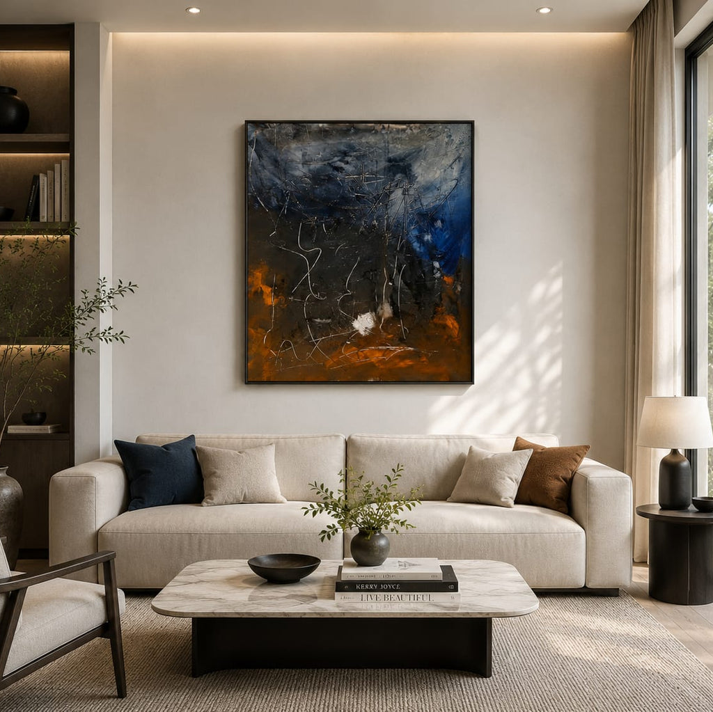Large abstract painting in navy blue, black and rust orange tones with white linework, handmade textured wall art above a living room sofa