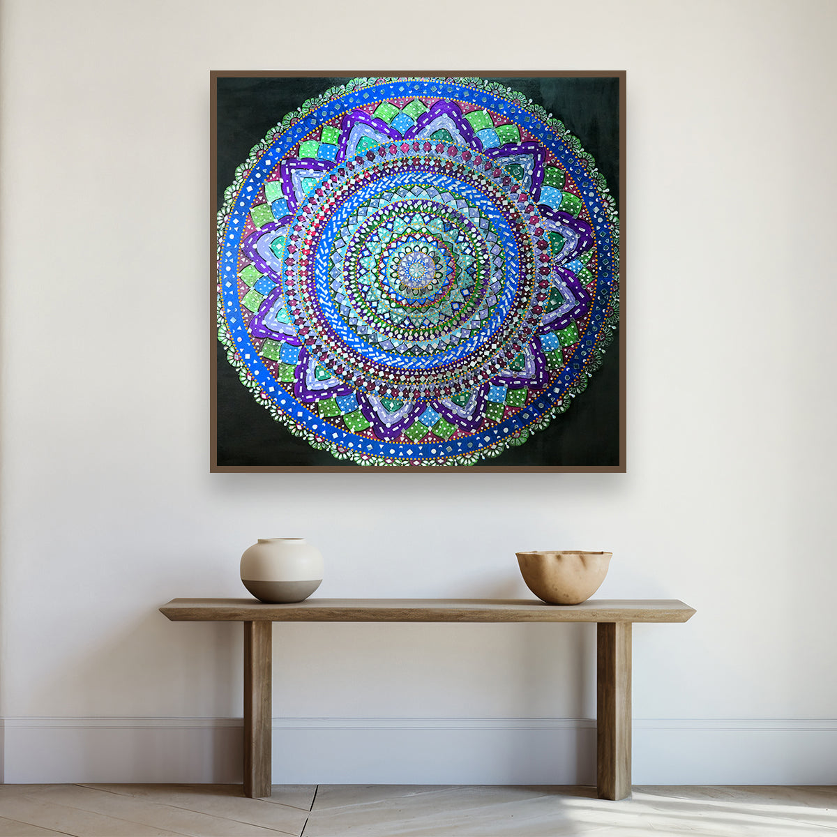 Tajalli mirror wall art catching ambient light — kinetic reflective surface handcrafted over 150 days, available at Artecasso UAE